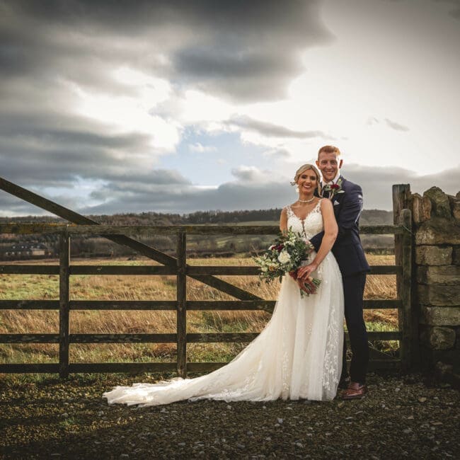 wharefdale grange bride and groom outside gate