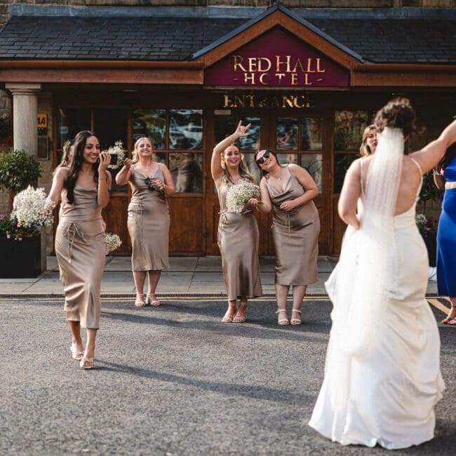 Jess & Ryan – 0086 bride walking down to entrance at red hall hotel