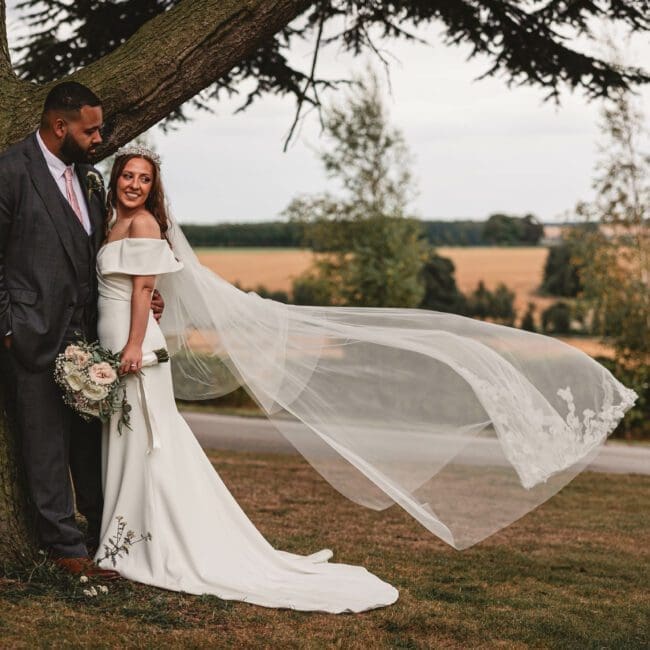 A brides vail flowing in the wind at Hazlewood castle | Yorkshire wedding photographer