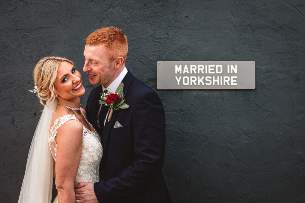 A couple embracing at their Yorkshire wedding