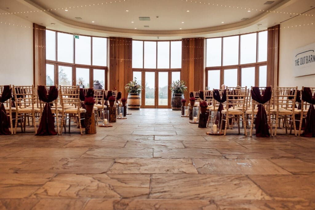 The outbarn main ceremony room with its stone floors and sachets on the chair - overlooking ribble valley