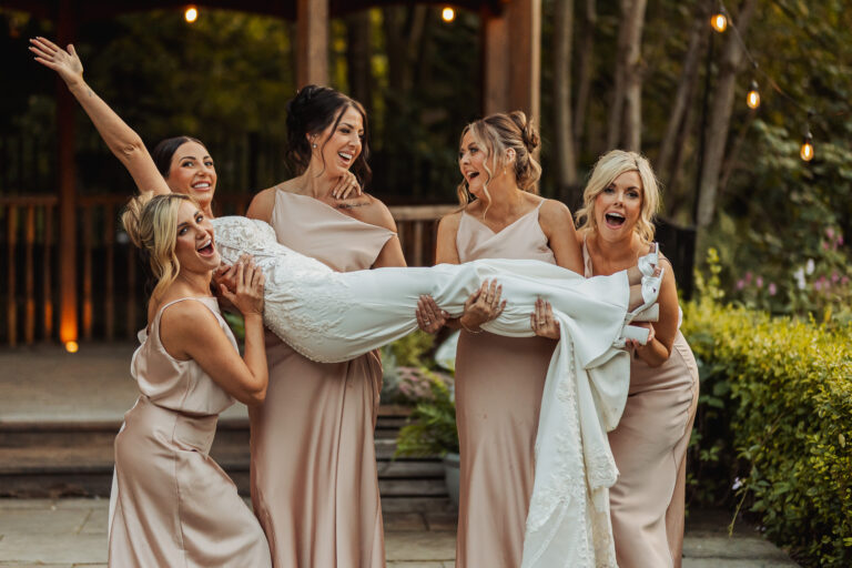 Bridesmaids holding each other at a yorkshire wedding photographer