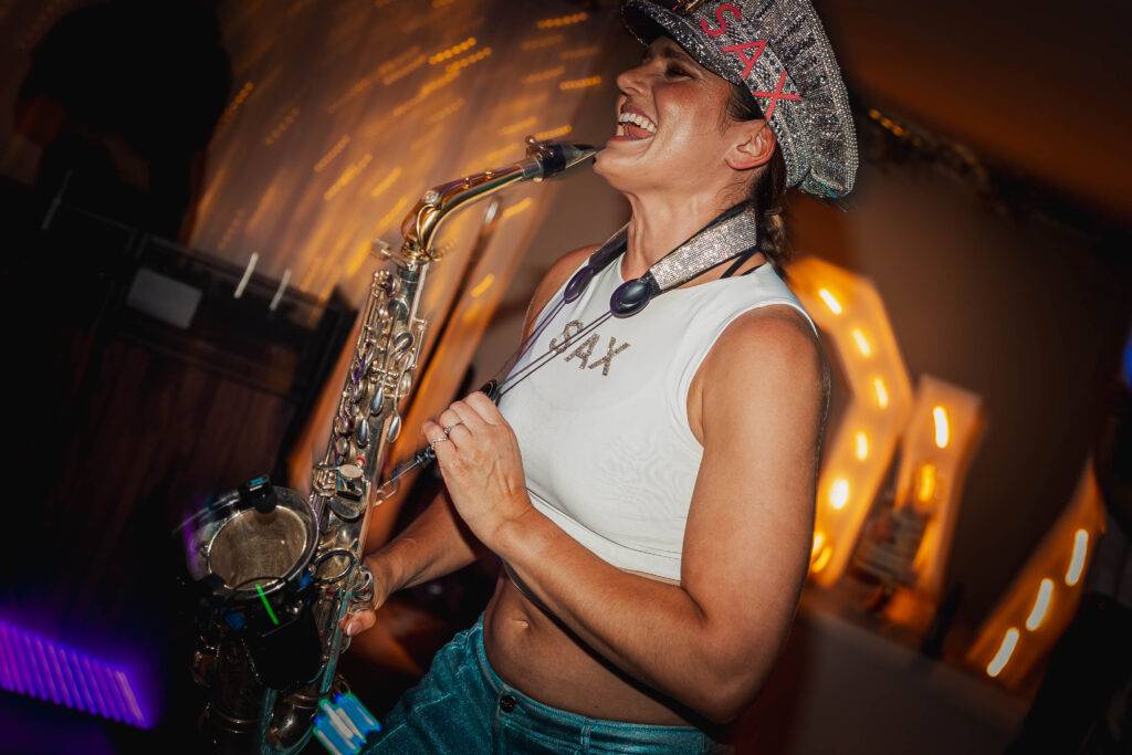 Saxophonist performing live on the dancefloor at a Yorkshire wedding reception