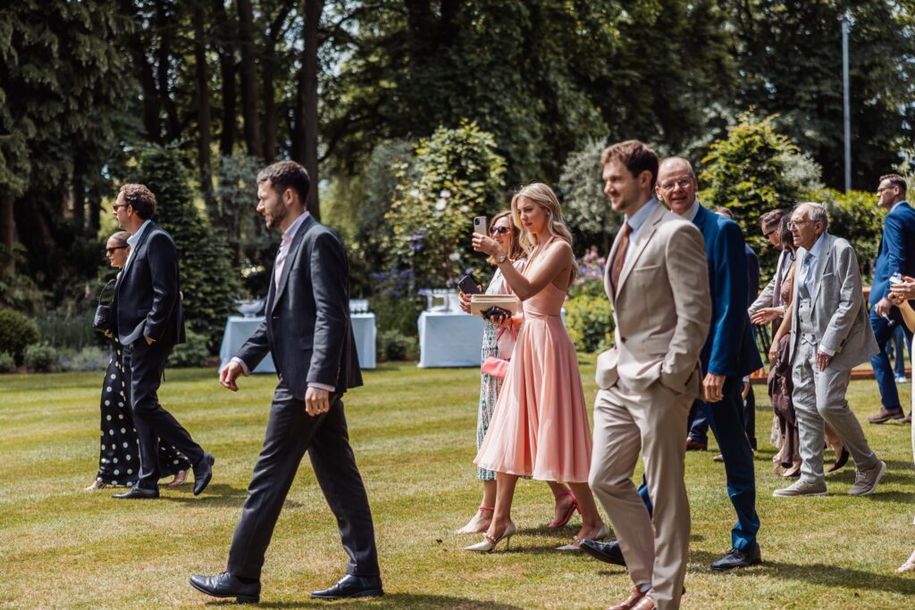 Guests make their way across the gardens to the ceremony at Wentbridge House Hotel near Pontefract.