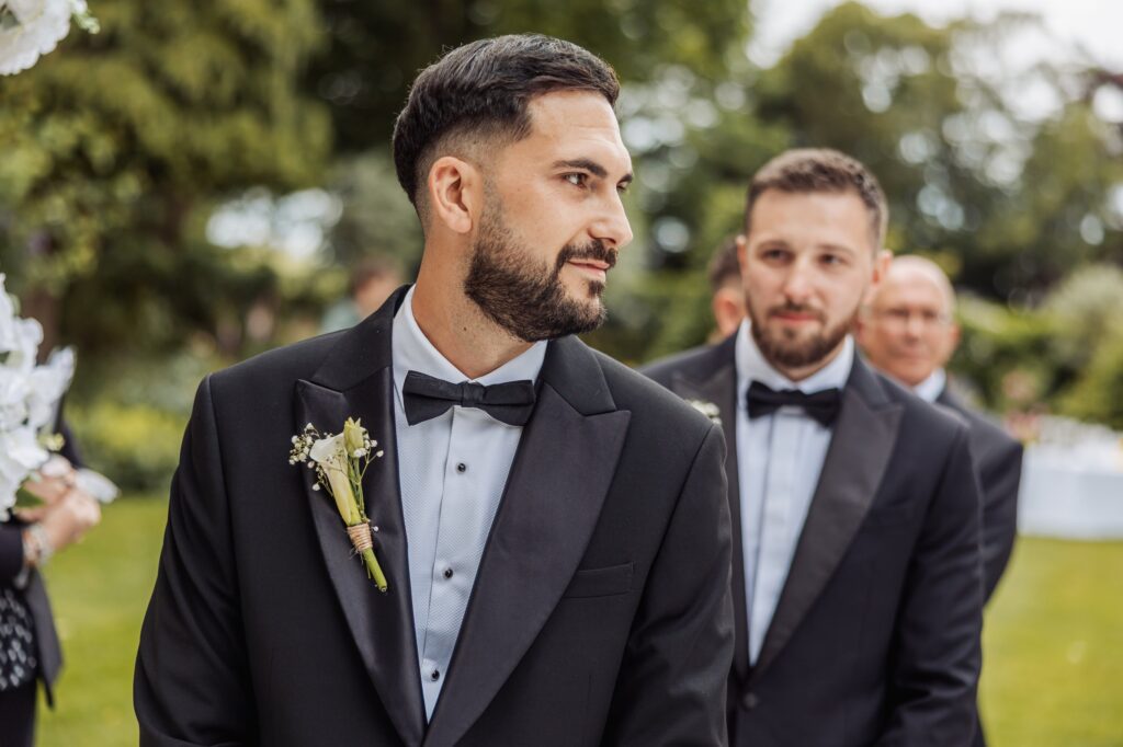 The groom and his groomsmen in black tie before the ceremony at Wentbridge House Hotel.