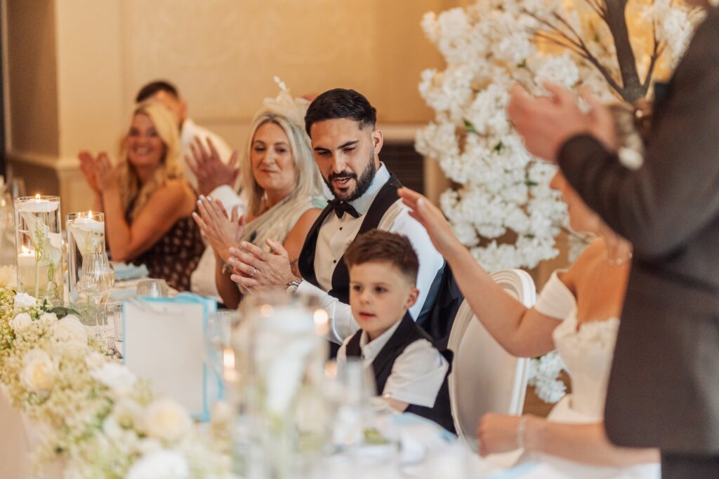 Applause along the top table during the wedding breakfast at Wentbridge House Hotel.