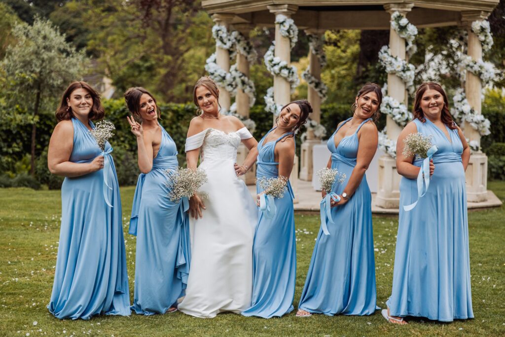 The bride and her bridesmaids in front of the floral pavilion at Wentbridge House Hotel.