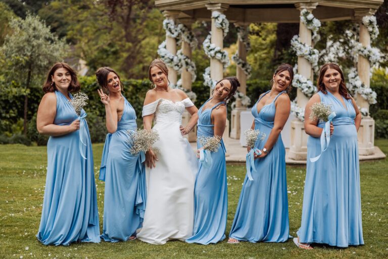 The bride and her bridesmaids in front of the floral pavilion at Wentbridge House Hotel.