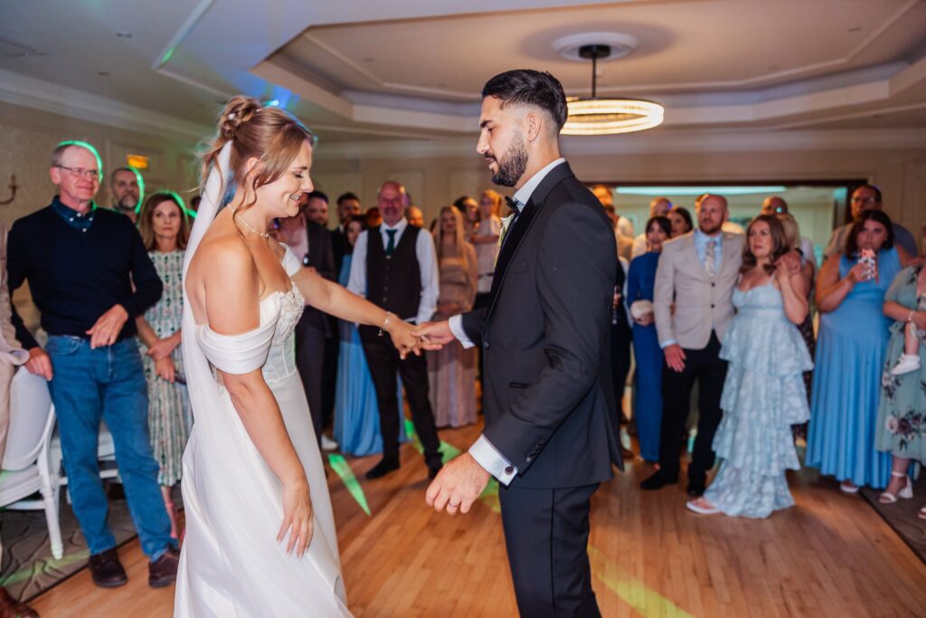 Bride and groom dance together as the evening party begins at their West Yorkshire wedding.