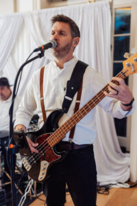 Guitarist from the live band performing during the evening reception at Hodsock Priory