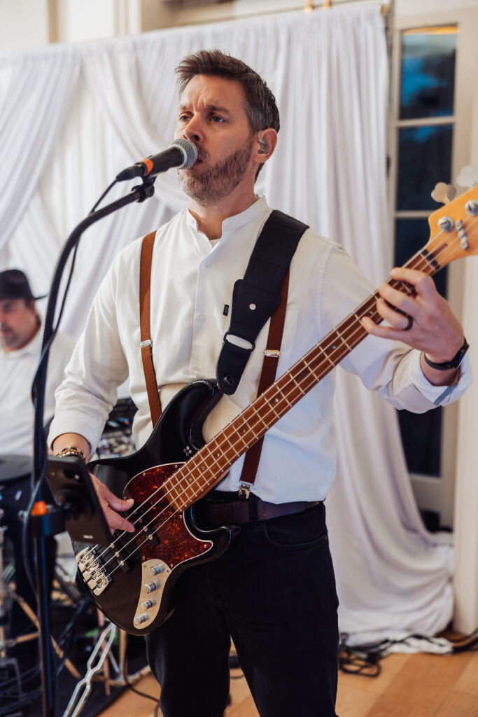 Guitarist from the live band performing during the evening reception at Hodsock Priory