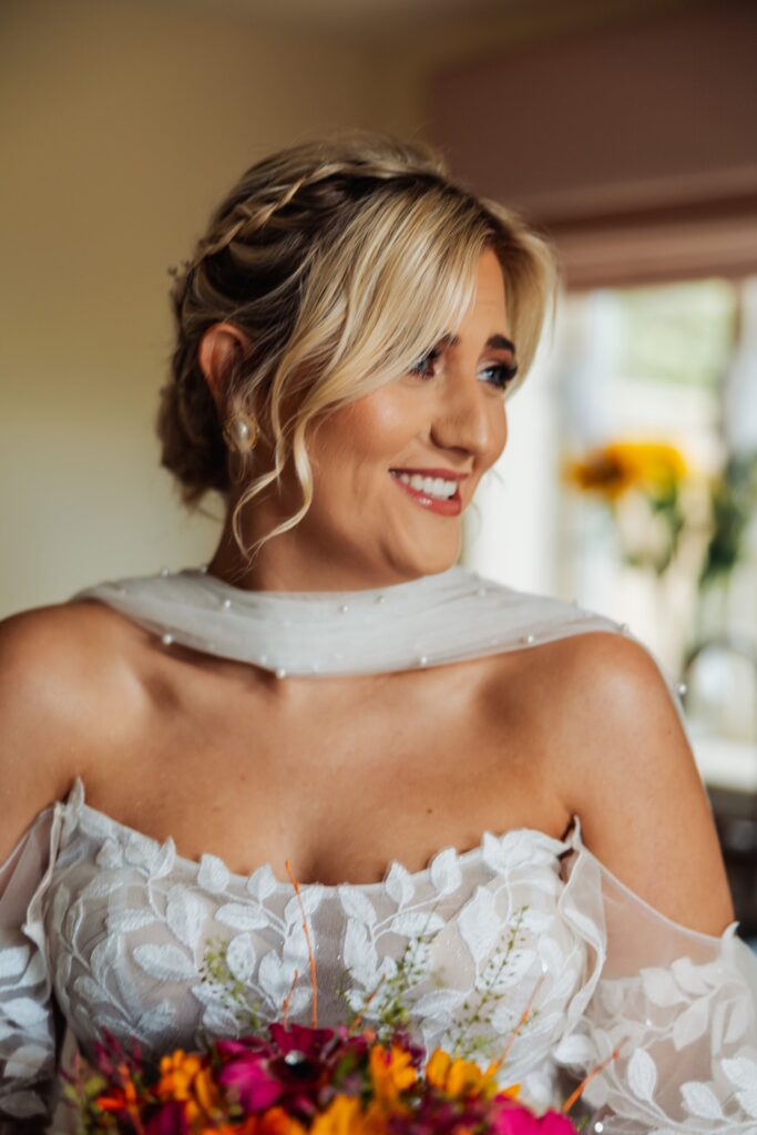 Bride with her hair and make-up finished before the ceremony at Sedgewell Barn