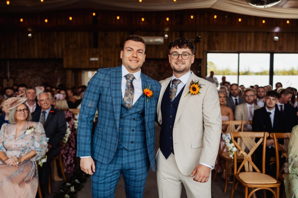 Groom and best man at the front of the barn before the ceremony at Sedgewell Barn