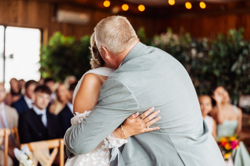 Father of the bride hugging her during the ceremony at Sedgewell Barn