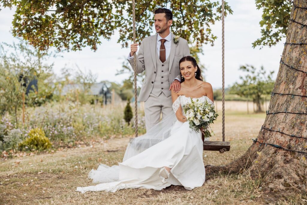 The couple pose on the tree swing in the gardens at Clayfield Farm near Pocklington.